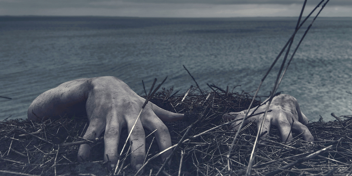 Creepy hands coming out of the water. Photo by Daniel Jensen on Unsplash